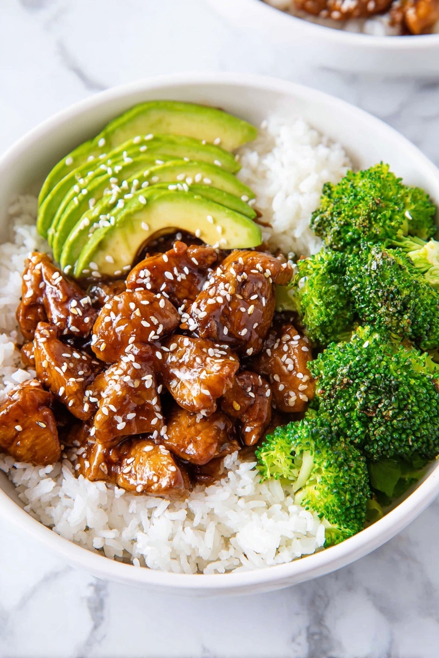 The dish is served in a white bowl with three main layers. The bottom layer is white rice, soft and fluffy, filling the base of the bowl. On top of the rice, there is a layer of small, shiny chunks of dark brown glazed chicken, sprinkled with white sesame seeds. To one side of the chicken, there is a small bunch of bright green broccoli florets with a slightly textured surface. Next to the broccoli, there are light green slices of avocado, fanned out and topped with a light sprinkle of black pepper and sesame seeds. The bowl rests on a white marbled surface. Photo taken with an iphone --ar 2:3 --v 7