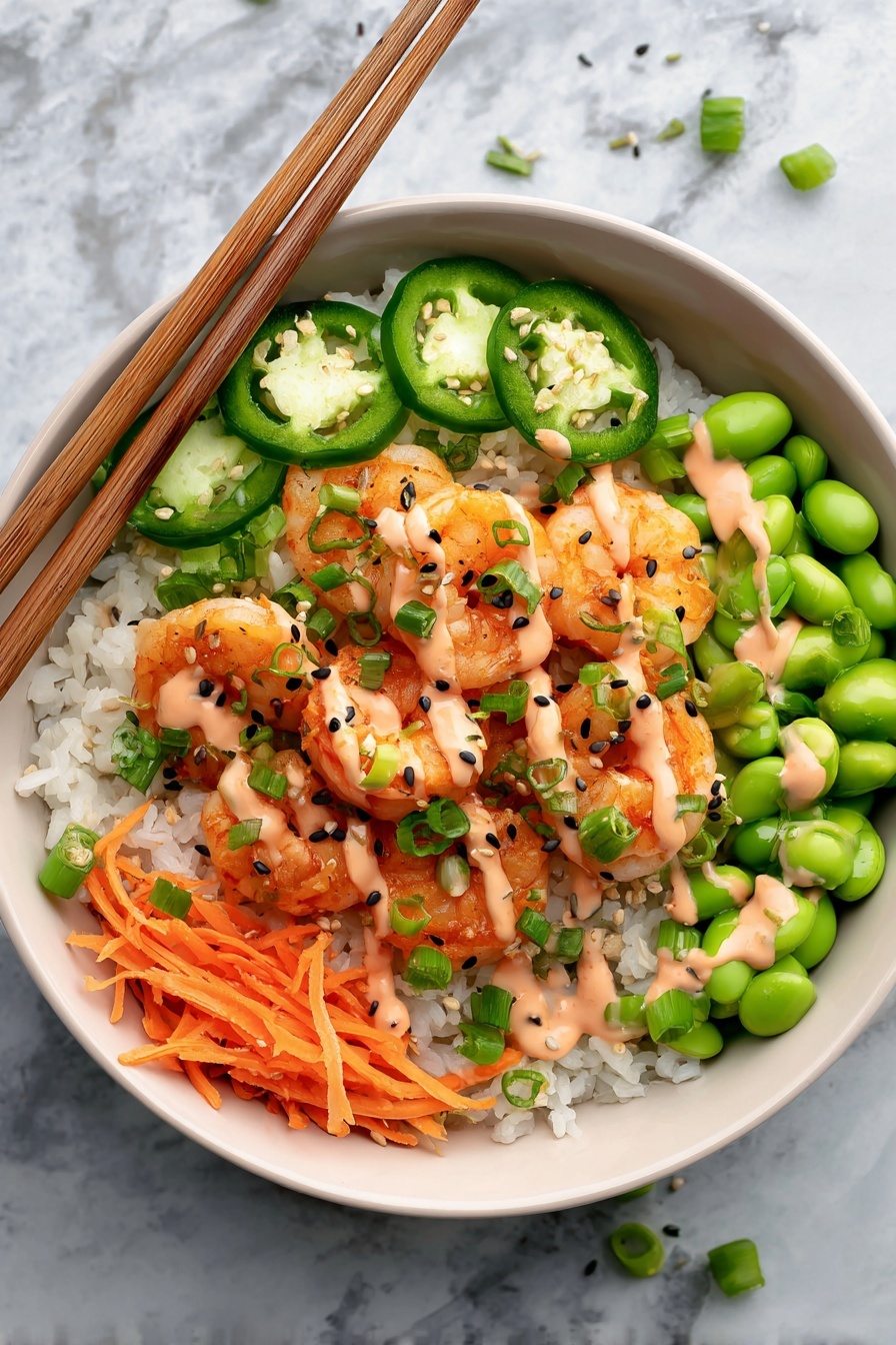A white bowl sits on a white marbled surface filled with layers of white rice at the bottom. On top, there are slices of green jalapeño peppers on the top left side and thinly sliced green cucumbers with a light pink sauce drizzled over them on the top right. Bright orange shredded carrots are placed on the bottom left. Next to the carrots are bright green edamame beans. In the center, there are orange shrimp pieces topped with black and white sesame seeds and chopped green onions. A pair of light brown chopsticks rest on the bowl’s edge, and small bowls with additional edamame and a red sauce are in the background. Fresh green cilantro leaves are scattered near the bowl photo taken with an iphone --ar 2:3 --v 7