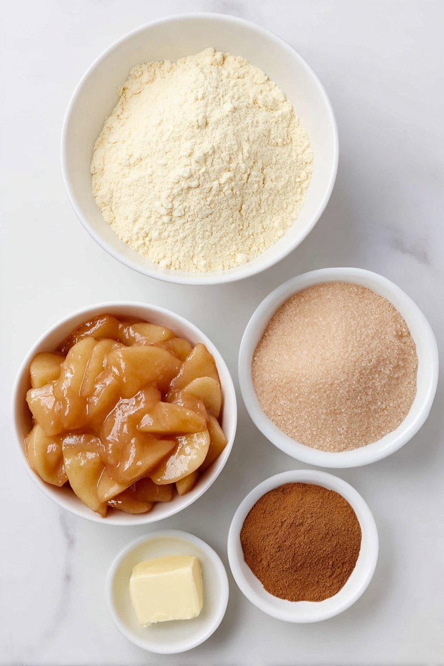 Flat lay of two small white ceramic bowls filled with golden apple pie filling with visible apple slices and cinnamon specks, a simple white ceramic bowl holding pale yellow gluten-free yellow cake mix, a small white ceramic bowl with packed light brown sugar, a small white ceramic bowl containing warm melted golden unsalted butter, and a neat heap of fine brown cinnamon powder arranged symmetrically, placed on a clean white marble surface, soft natural light, photo taken with an iPhone, professional food photography style, fresh ingredients, white ceramic bowls, no bottles, no duplicates, no utensils, no packaging --ar 2:3 --v 7 --p m7354615311229779997