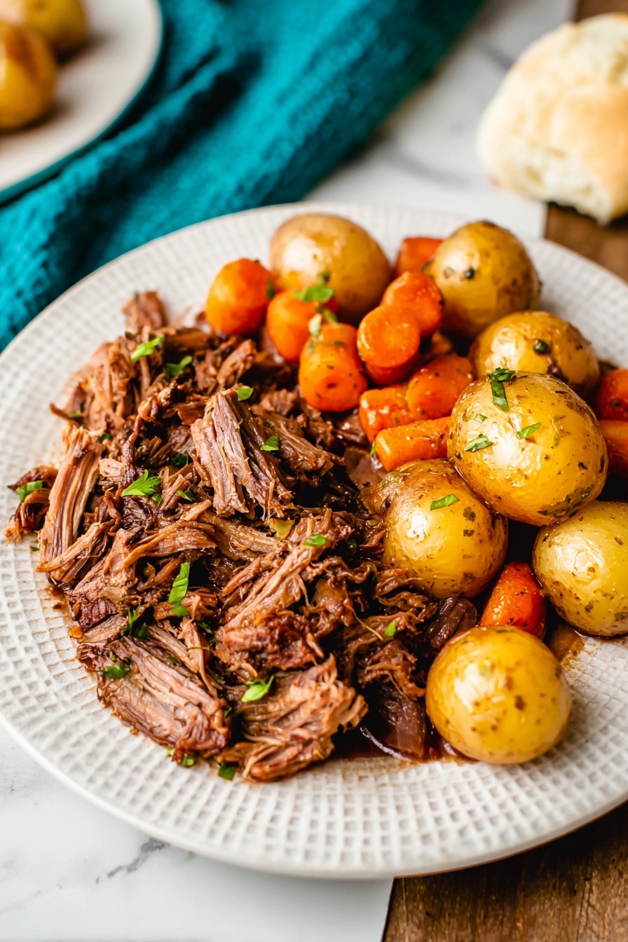 A white plate with a serving of shredded brown meat on the left side. On the right side, there is a mix of small round yellow potatoes and bright orange carrot pieces, some cut into smaller sizes. The potatoes and carrots look cooked with a light seasoning of black specks and small green herb pieces scattered on top. The plate rests on a white marbled textured surface with a bit of a light blue cloth barely visible under the plate. Photo taken with an iphone --ar 2:3 --v 7